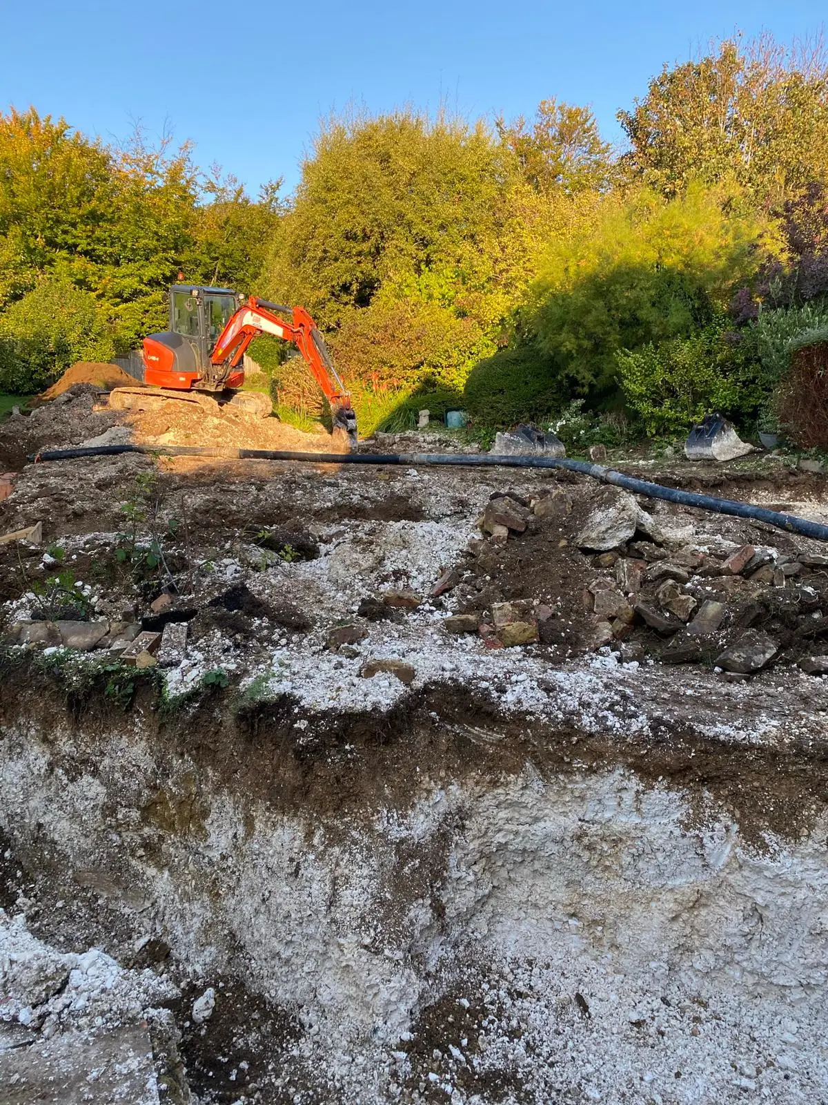 A digger cutting trenches
