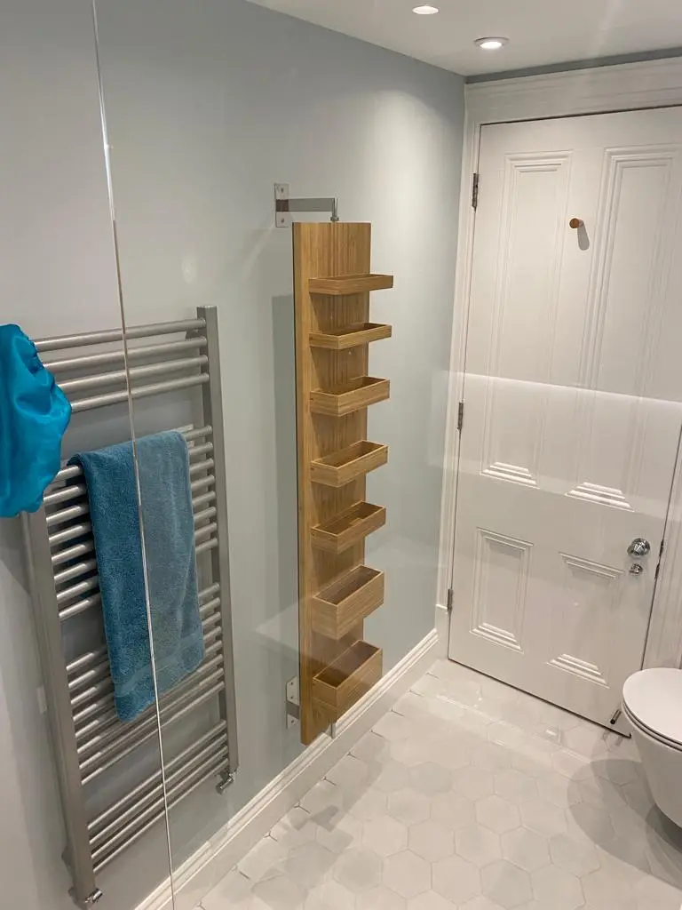 Heated towel rail and wooden shelving
